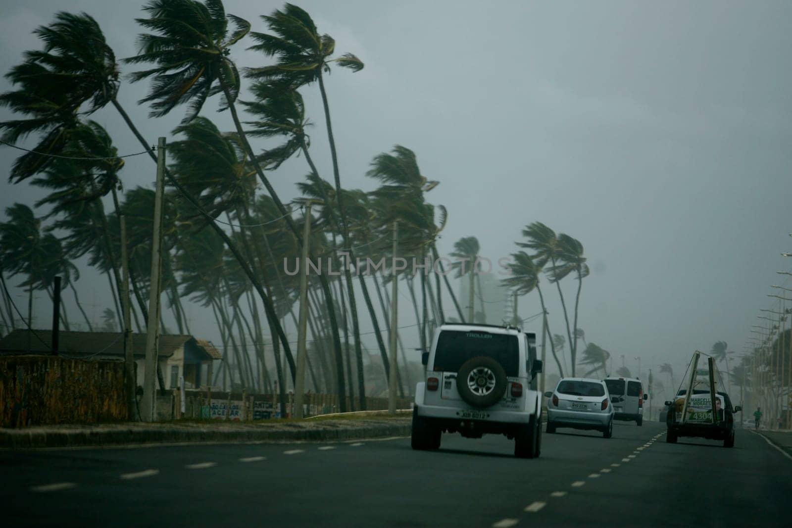 salvador, bahia / brazil - october 4, 2014: vehicles are seen walking on a street in the city of Salvador during rainy weather...