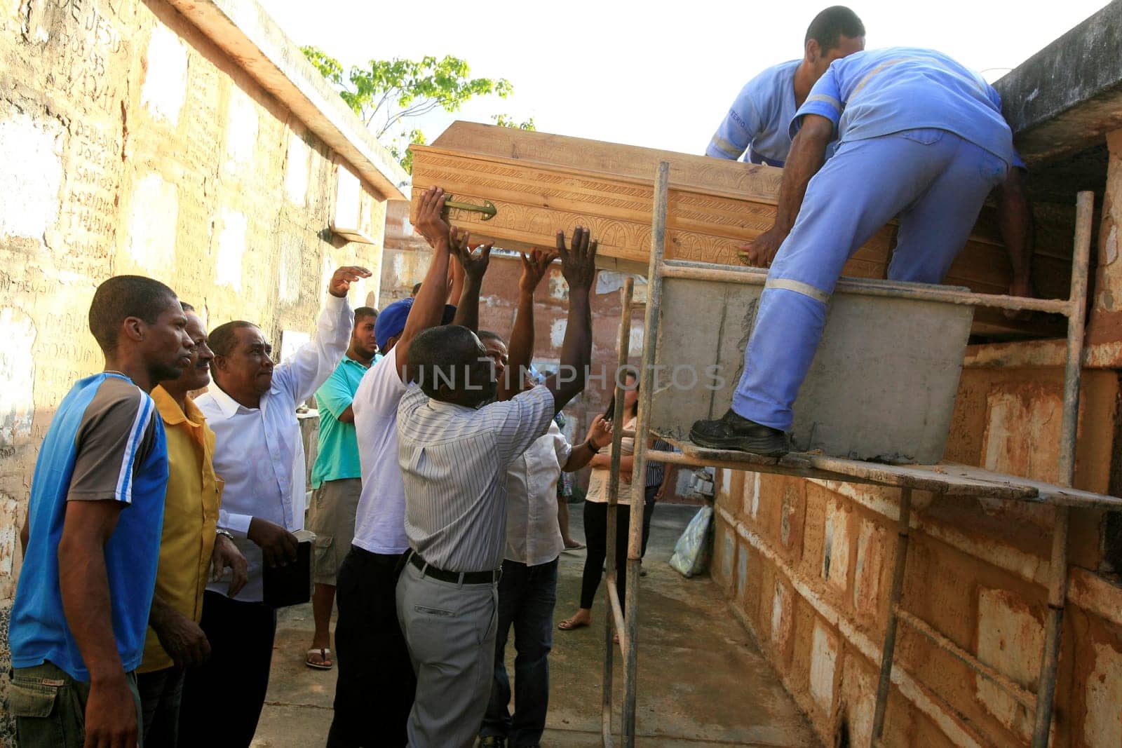 salvador, bahia / brazil - november 7, 2012: people are seen during seputation of a person in the Quinta dos Lazaros cemetery in the city of Salvador.