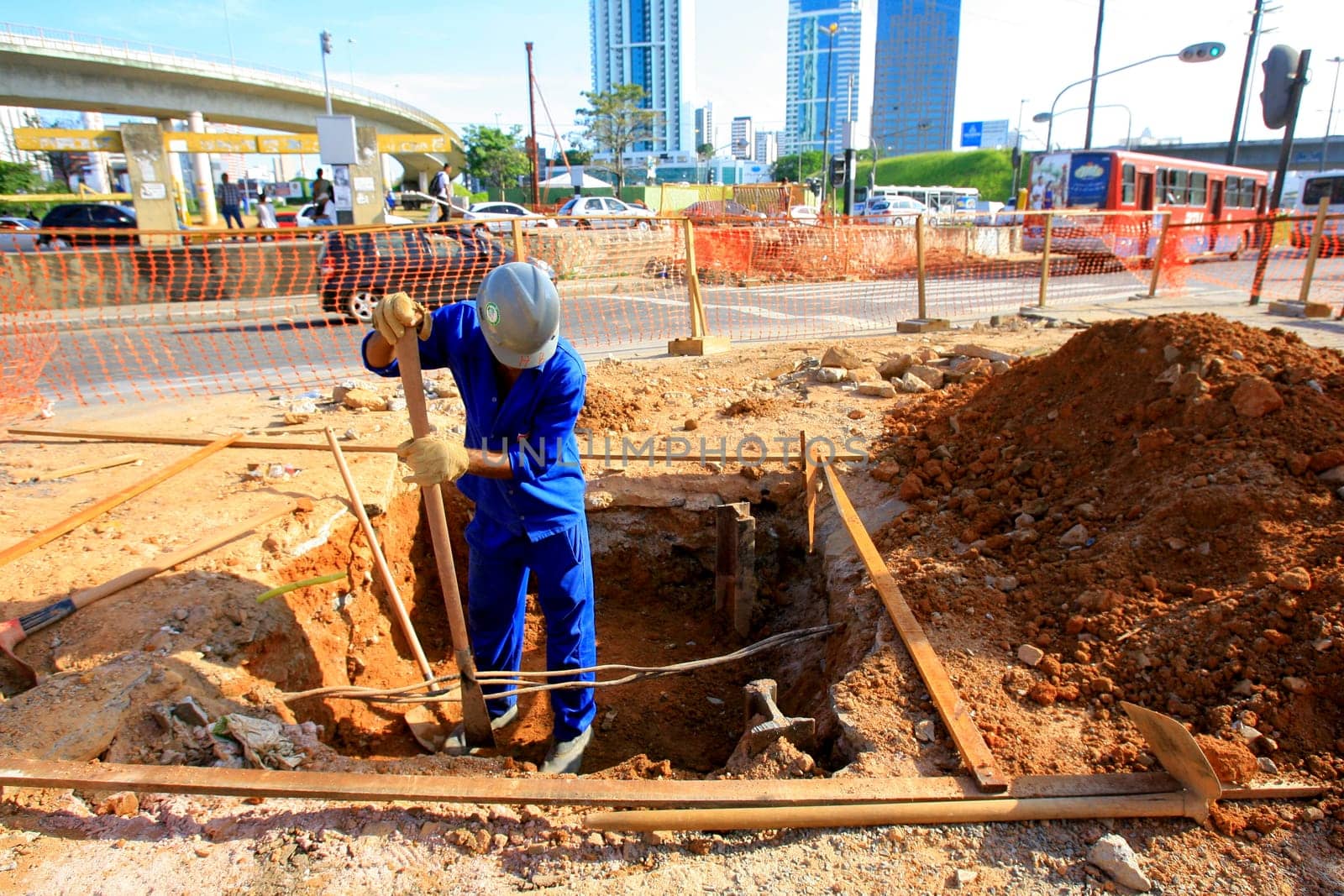 salvador, bahia / brazil - december 5, 2013: worker is building a walkway in the city of Salvador...