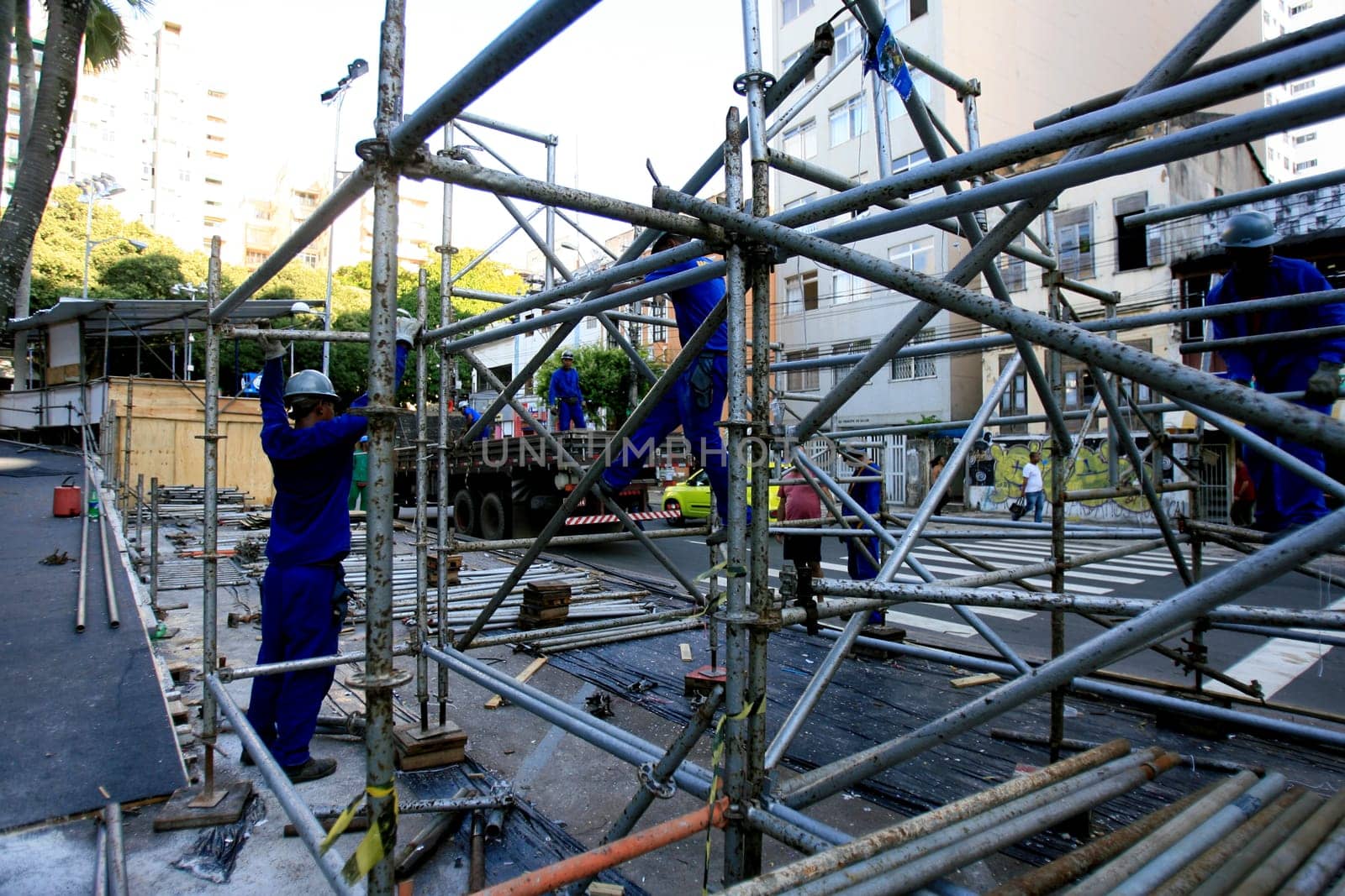 salvador, bahia / barazil - march 6, 2014: workers work to dismantle the metal structure where the boxes used in the carnival of Salvador were installed.