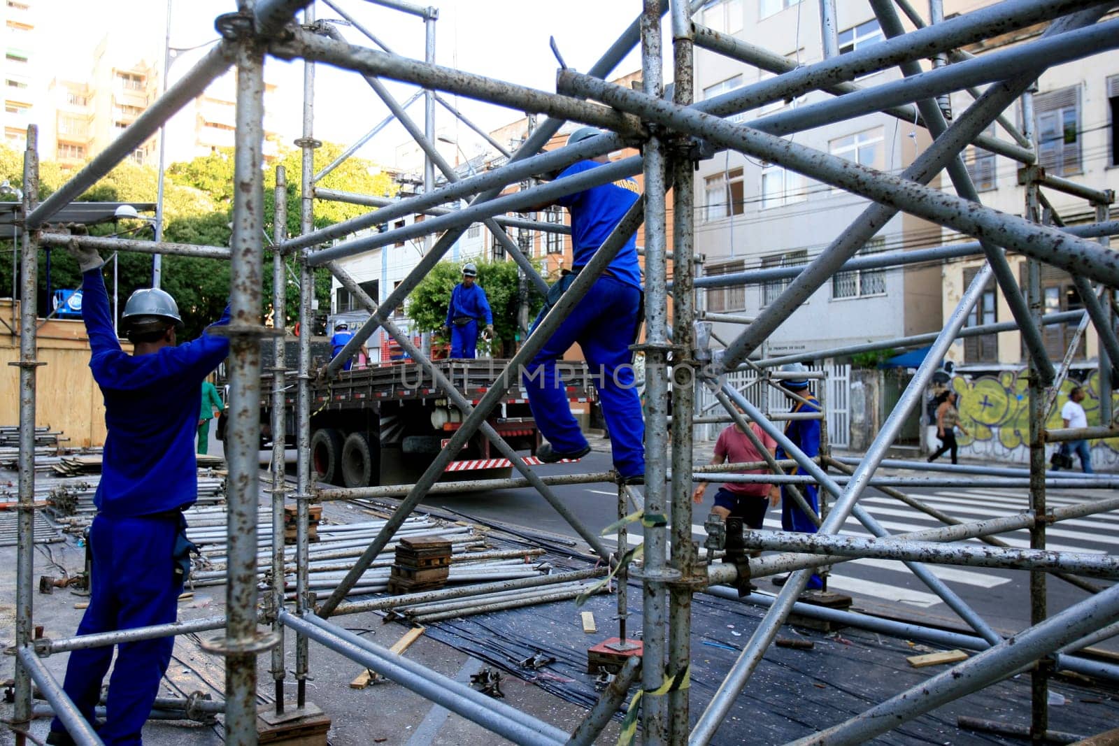 salvador, bahia / barazil - march 6, 2014: workers work to dismantle the metal structure where the boxes used in the carnival of Salvador were installed.