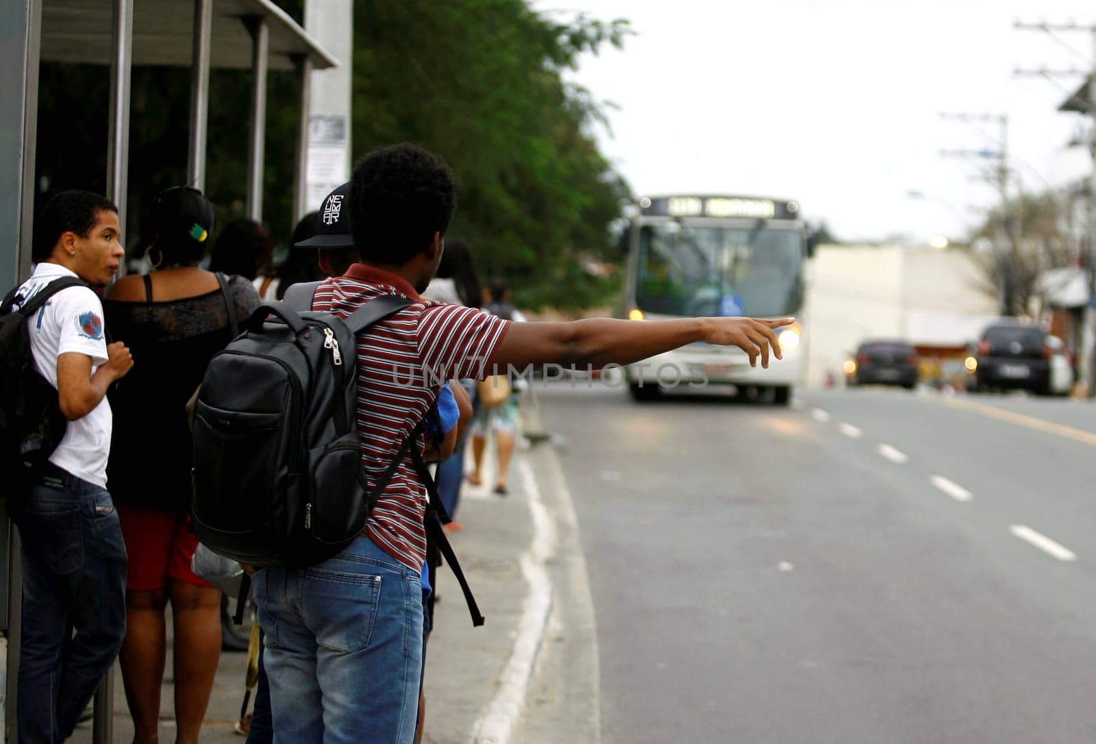 salvador, bahia / brazil - august 7, 2014: people are seen at public transport bus stop in the city of Salvador.