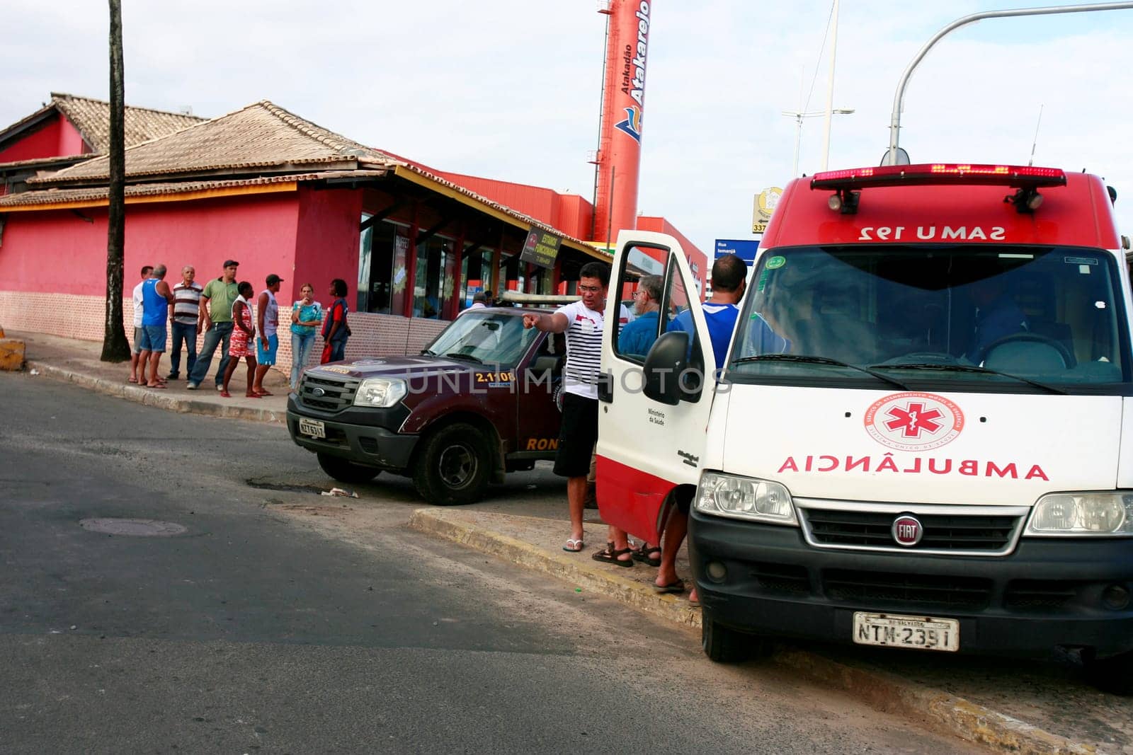 salvador, bahia / brazil - august 13, 2015: Ambulance of the Samu 192 provides average care to a person who fell into a hole in the Itapua neighborhood in the city of Salvador.