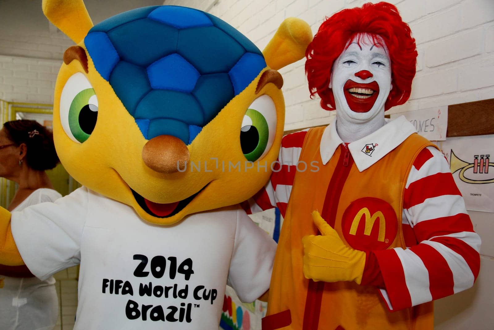 salvador, bahia / brazil - may 24, 2013: Ronald McDonald's and Fuleco, mascot of the Fifa World Cup, 2014 in Brazil, are seen in a public school in the city of Salvador.