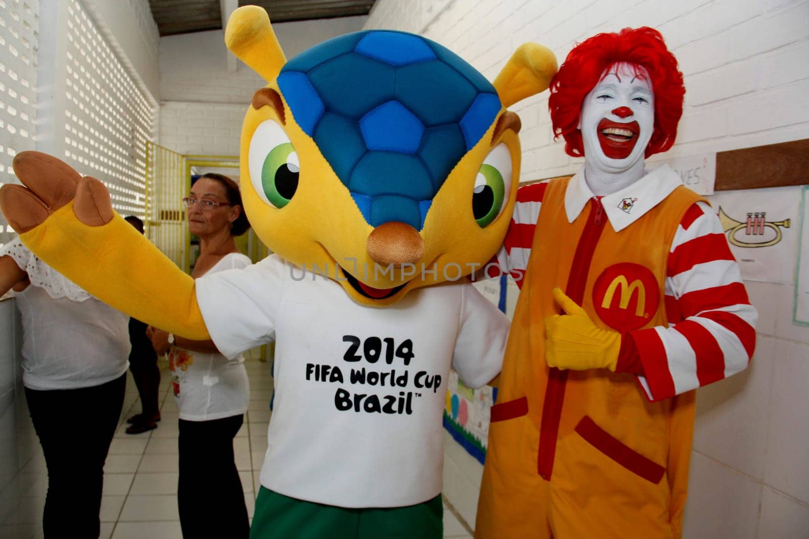 salvador, bahia / brazil - may 24, 2013: Ronald McDonald's and Fuleco, mascot of the Fifa World Cup, 2014 in Brazil, are seen in a public school in the city of Salvador.