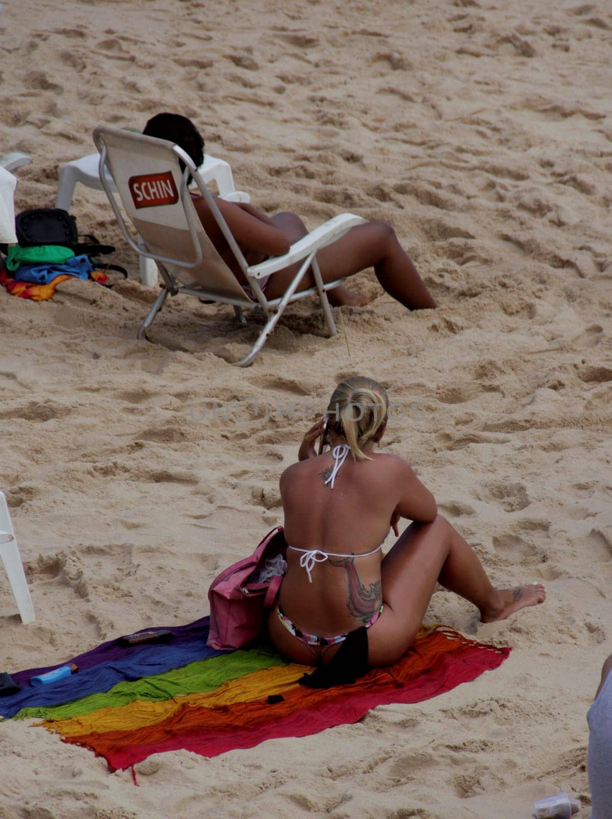salvador, bahia / brazil - november 23, 2014: women are seen at Barra beach in the city of Salvador.