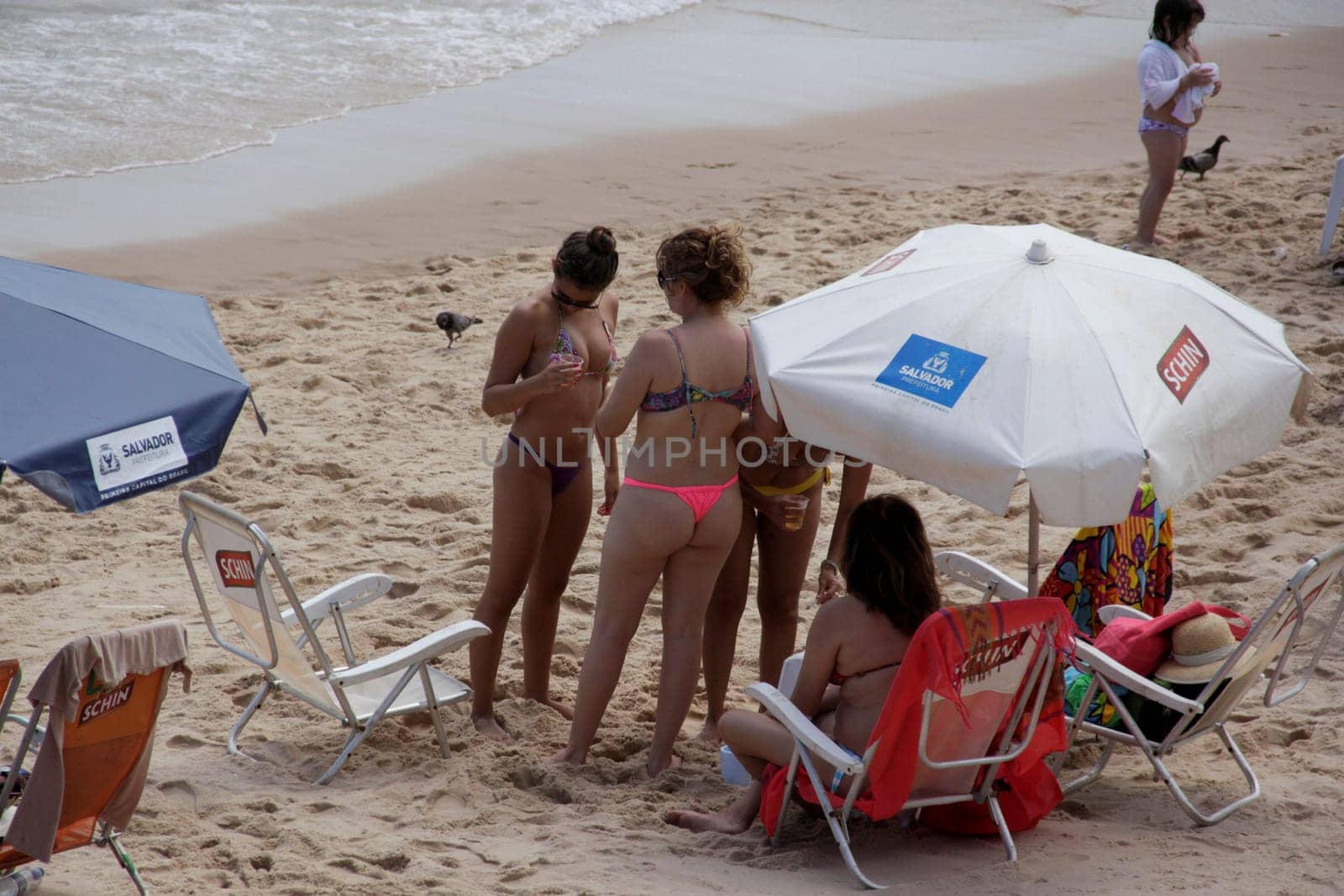salvador, bahia / brazil - november 23, 2014: women are seen at Barra beach in the city of Salvador.
