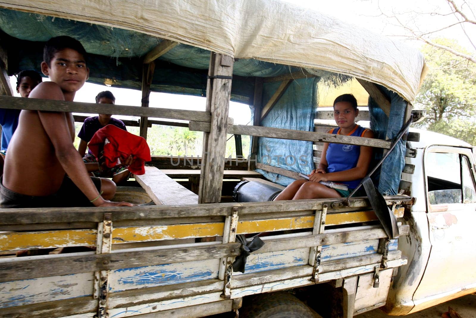 arataca, bahia / brazil - september 30, 2011: public school students being transported on arara stick - truck body - in the city of Arataca, in southern Bahia.