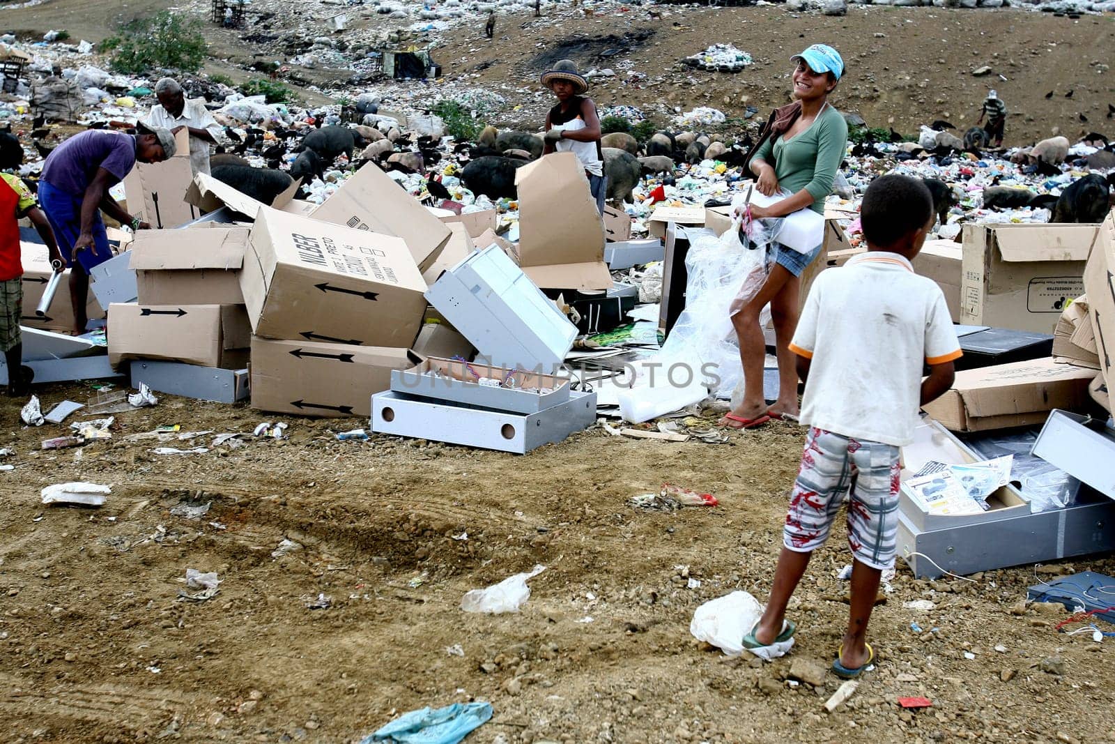 Itabuna, bahia / brazil - september 27, 2011: people are seen turning through the garbage to collect recycling material at the sanitary landfill in the city of Itabuna......