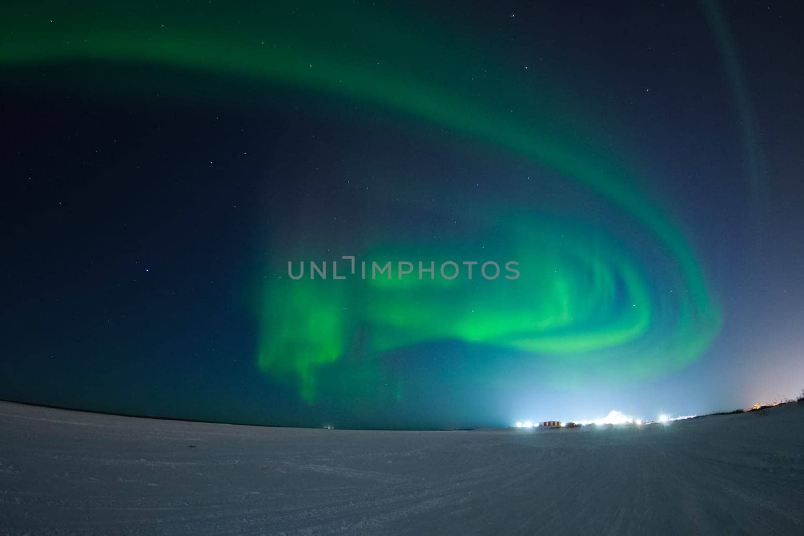 Northern Lights in the night sky. Northern Lights in the tundra.