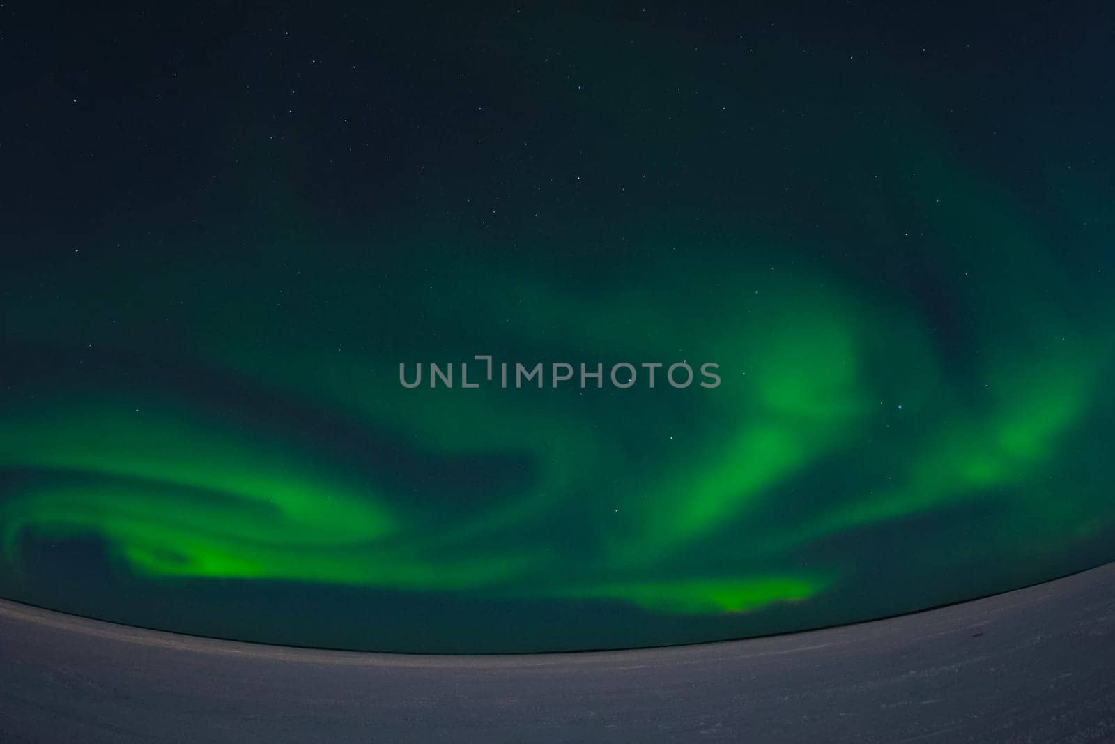 Northern Lights in the night sky. Northern Lights in the tundra.