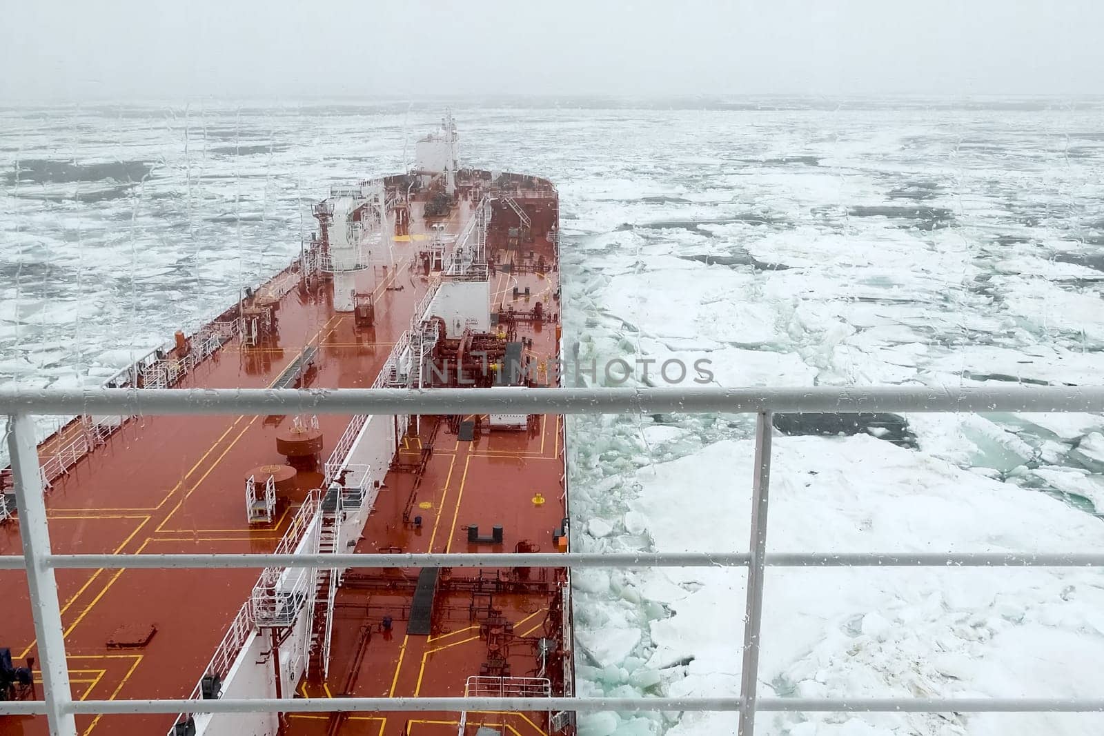 The feed of a ship sailing in the Arctic. Landscape of the Arctic from the deck of the tanker.