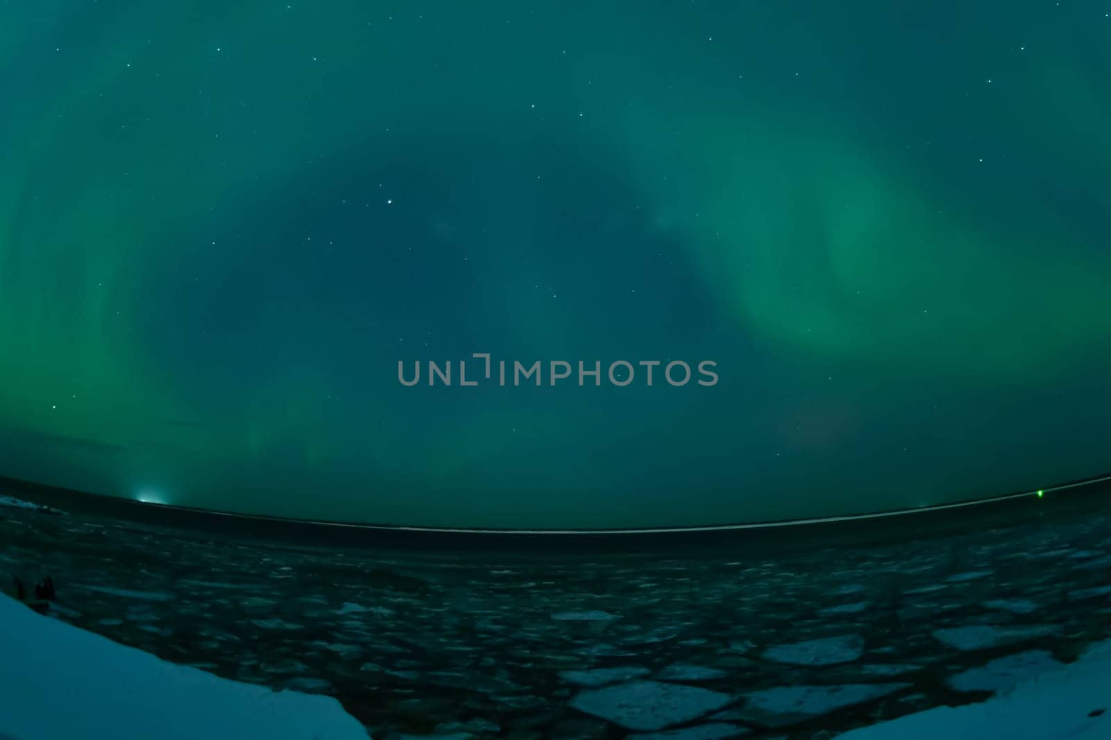 Northern Lights in the night sky. Northern Lights in the tundra.