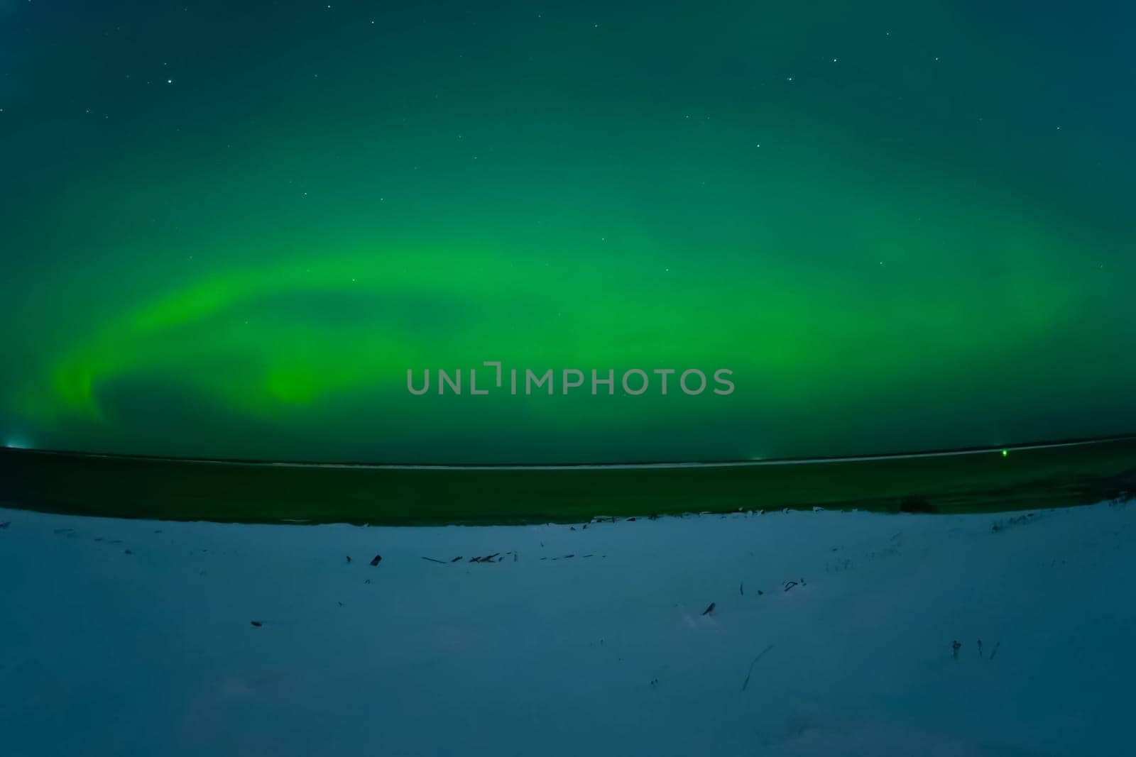 Northern Lights in the night sky. Northern Lights in the tundra.