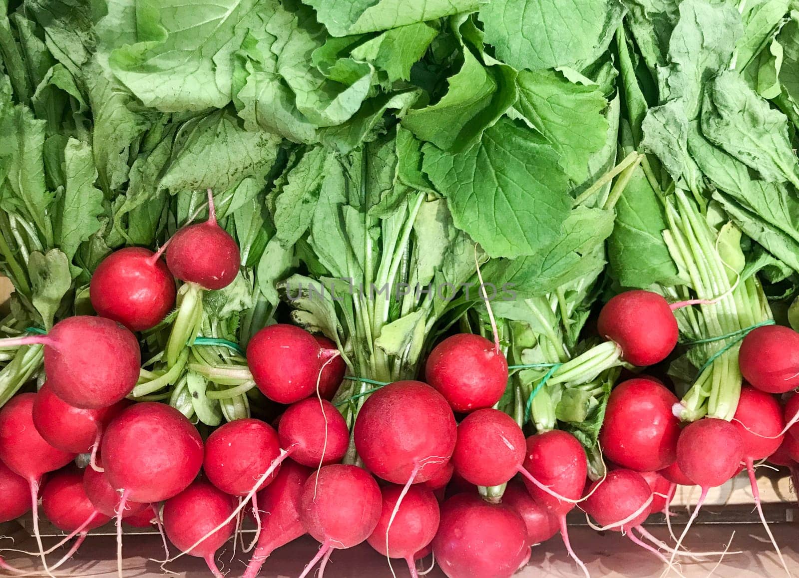 High Angle View Of Radish For Sale. Healthy Fresh Food Background.
