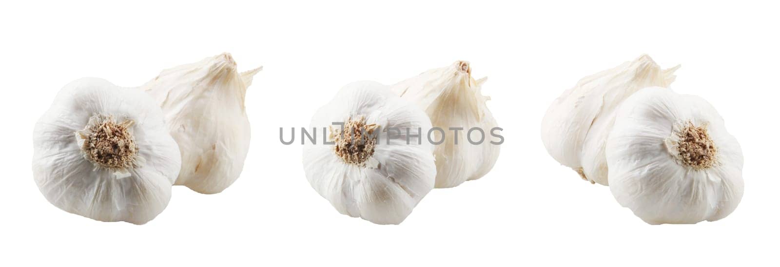 Close-Up Of Garlic Bulbs Against White Background.