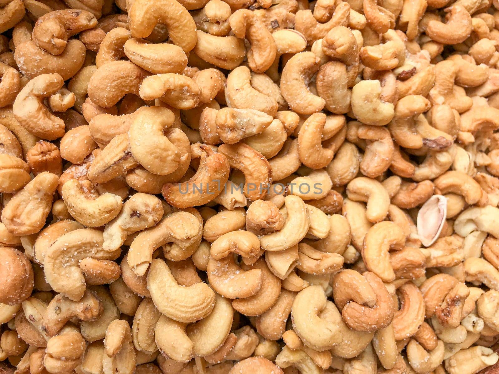 Close-Up Of Cashew Nuts Peeled. Healthy Fresh Food Background.