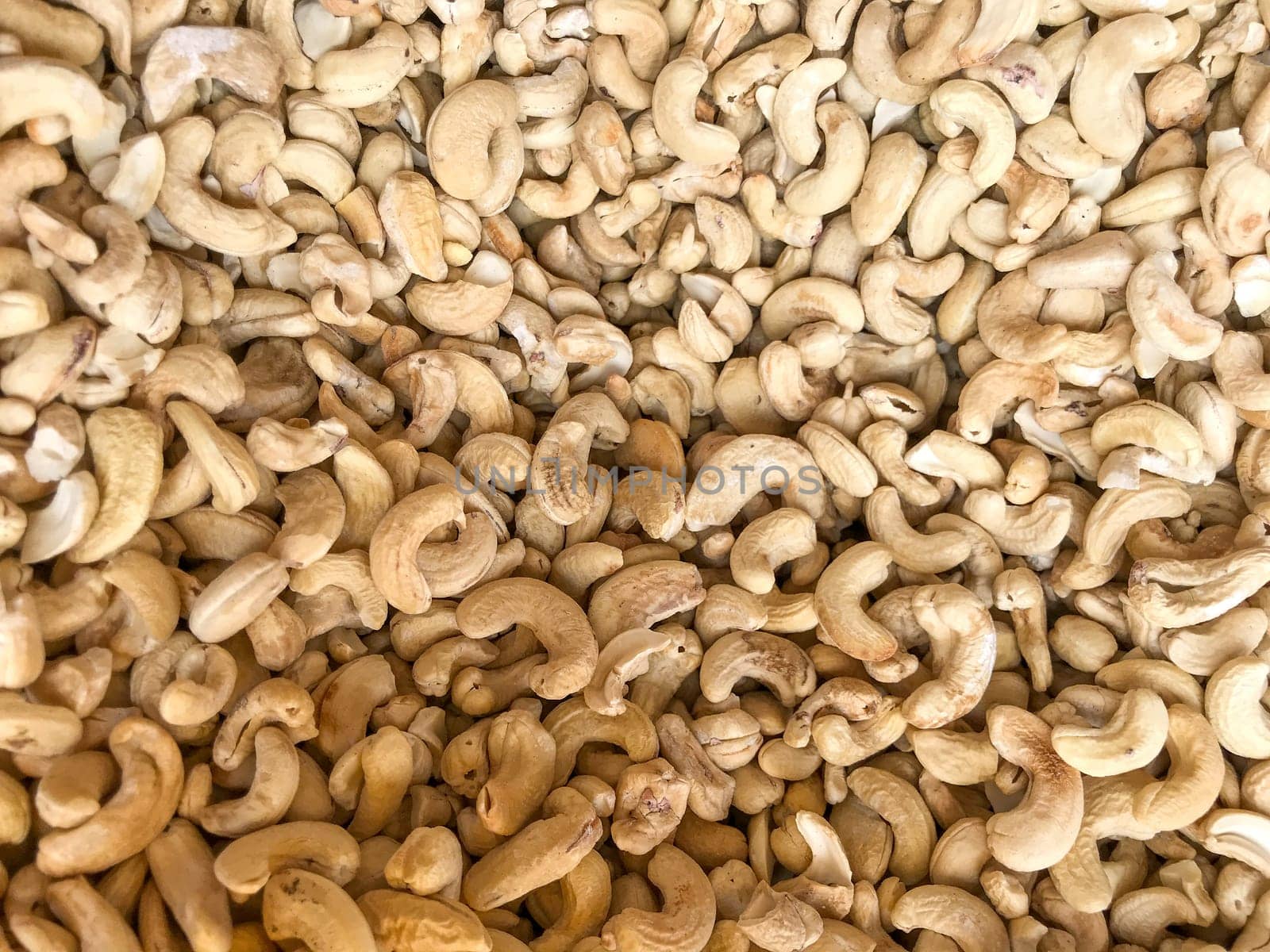 Close-Up Of Cashew Nuts Peeled. Healthy Fresh Food Background.