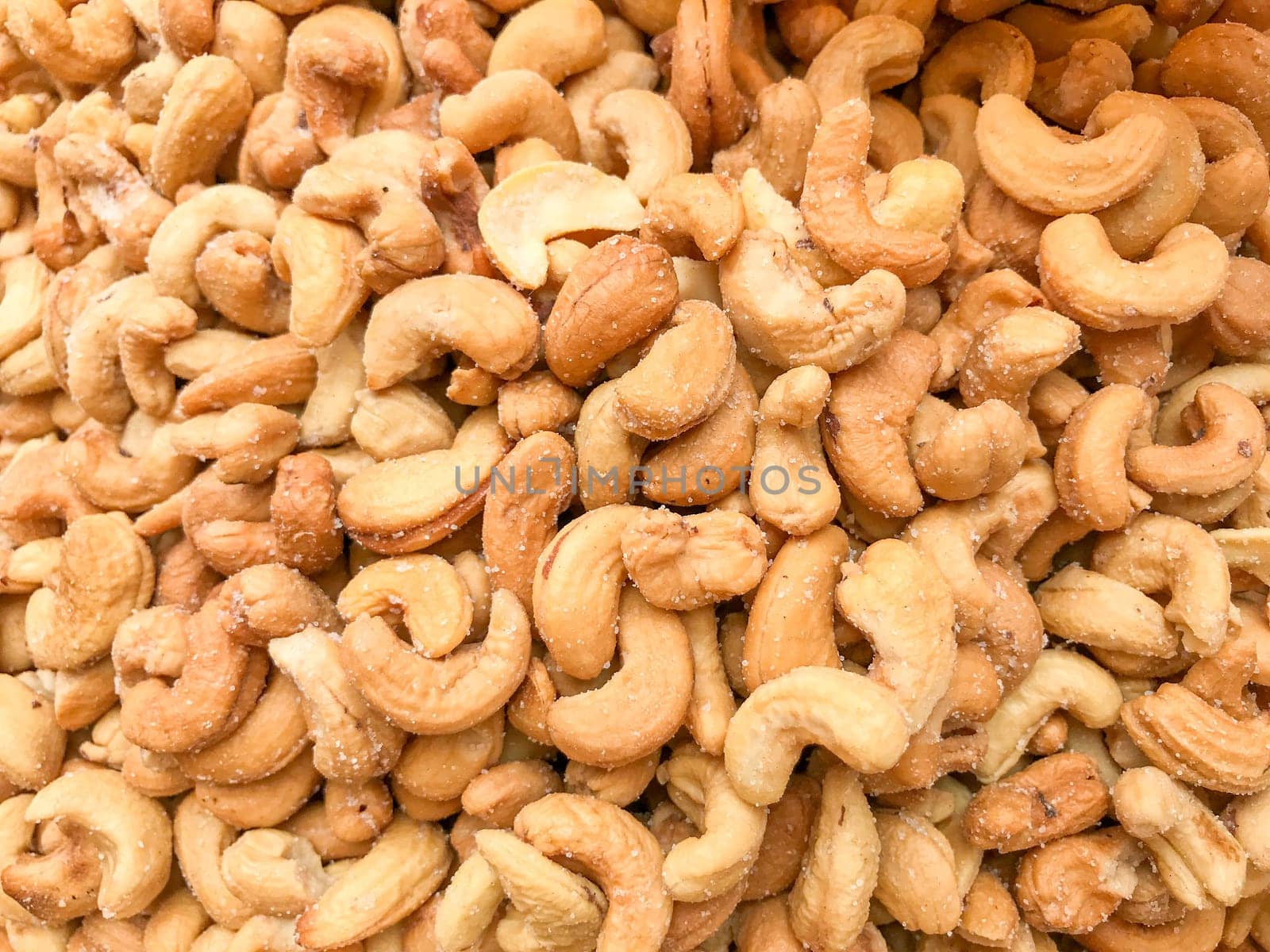 Close-Up Of Cashew Nuts Peeled. Healthy Fresh Food Background.