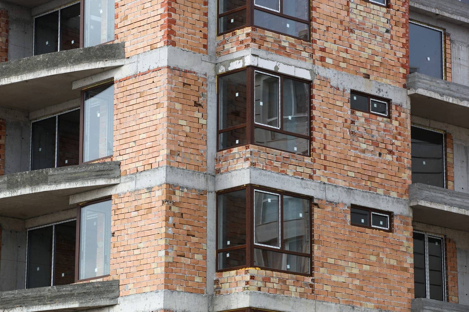 Newly built building in a residential complex. New construction site
