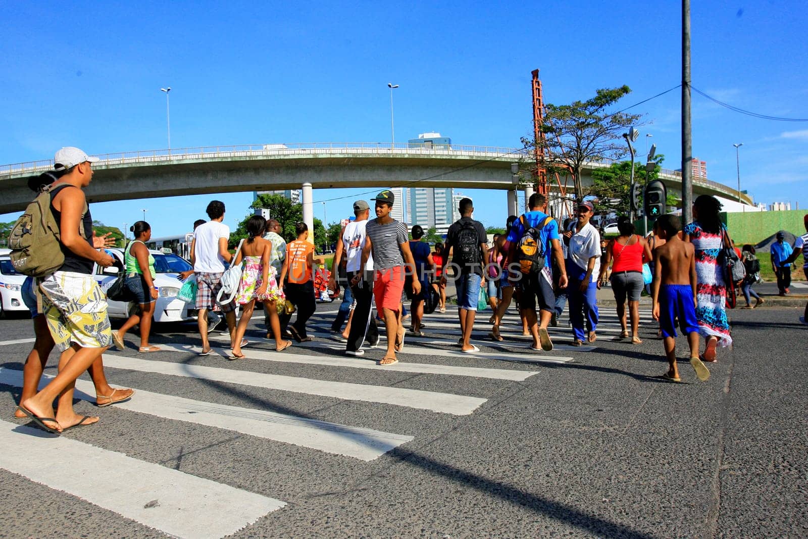 salvador, bahia / brazil - december 5, 2013: people are seen crossing the street in a pedestrian lane in the city of Salvador.