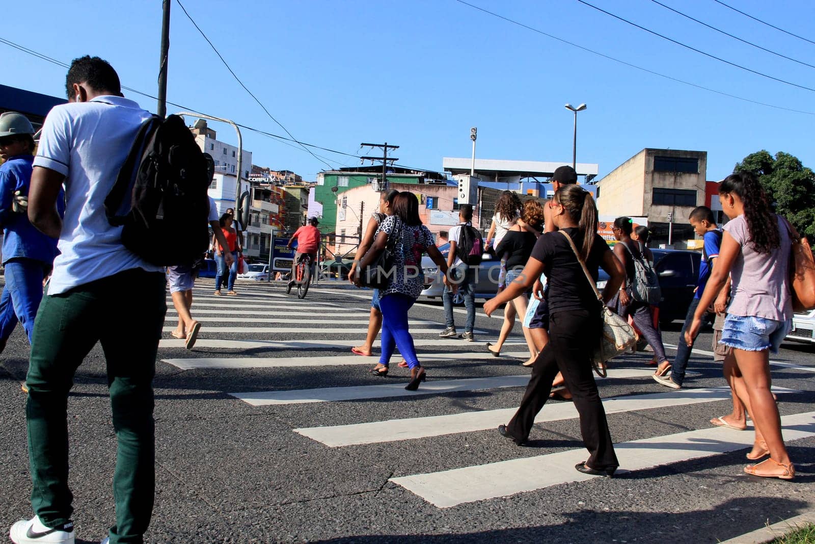 salvador, bahia / brazil - december 5, 2013: people are seen crossing the street in a pedestrian lane in the city of Salvador.
