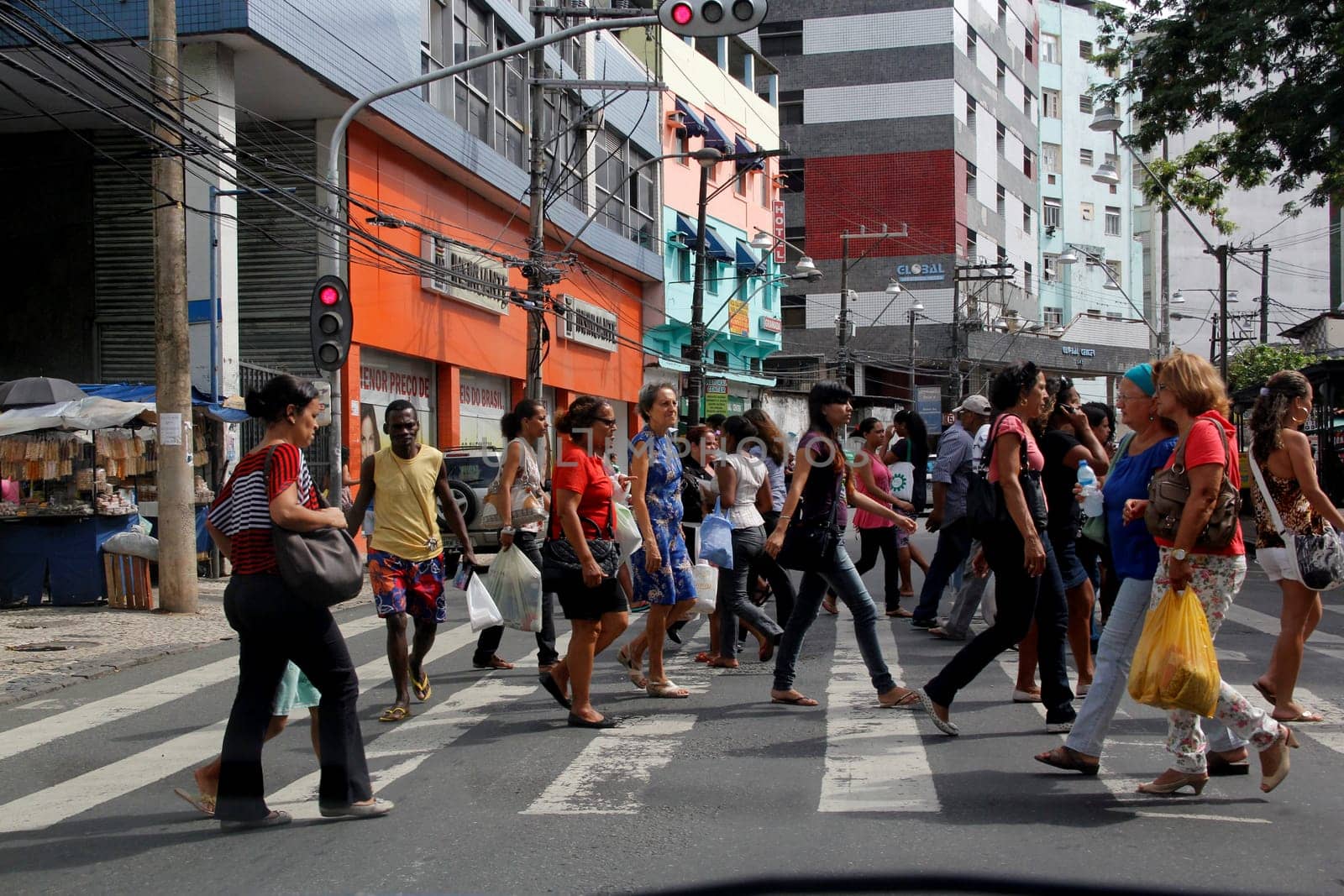 salvador, bahia / brazil - january 23, 2013: people are seen crossing the street in a pedestrian lane in downtown Salvador..