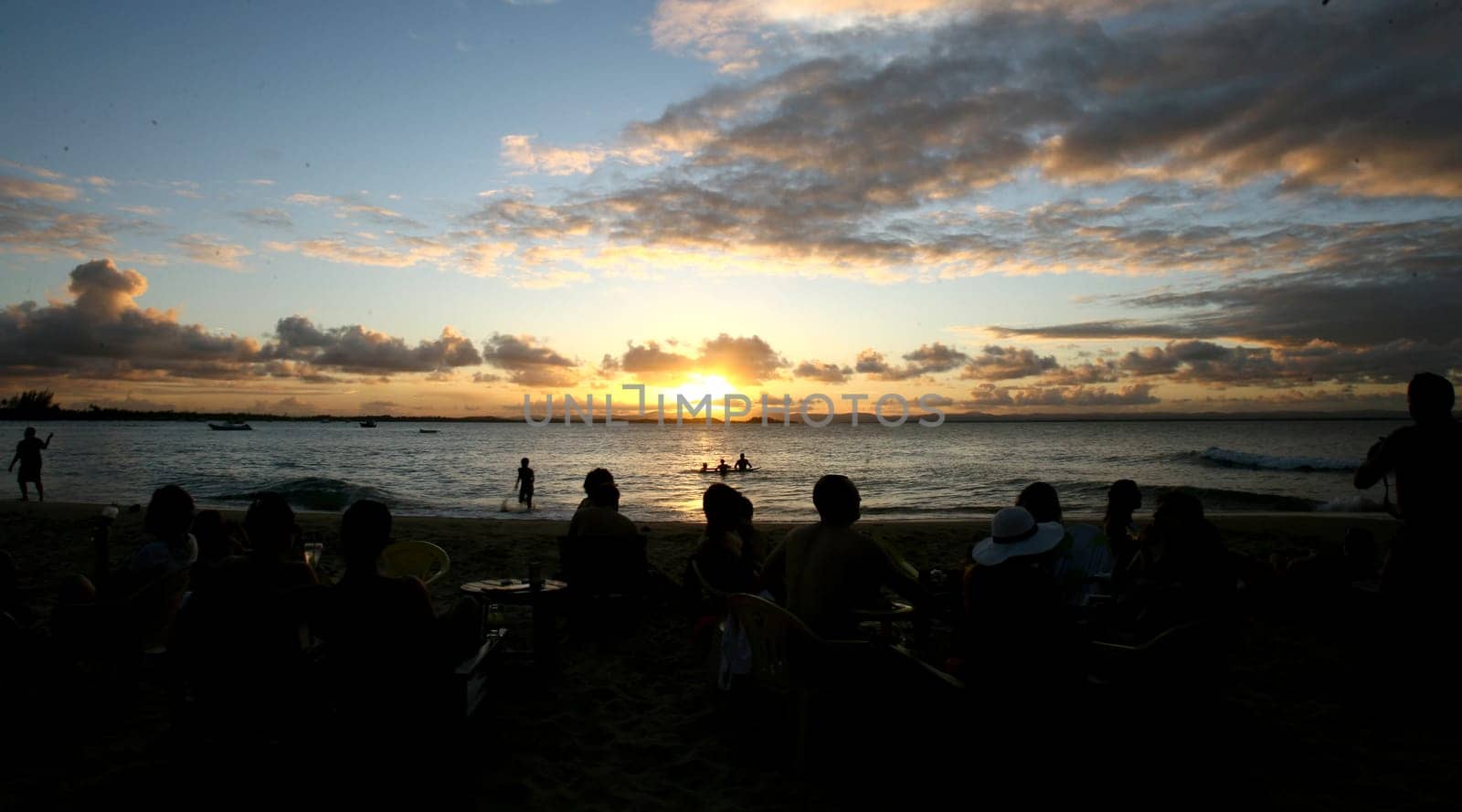 Camamu, bahia / brazil - december 27, 2011: people are seen during sunset at Ponta de Muta beach, in the district of Barra Grande in the city of Camamu.