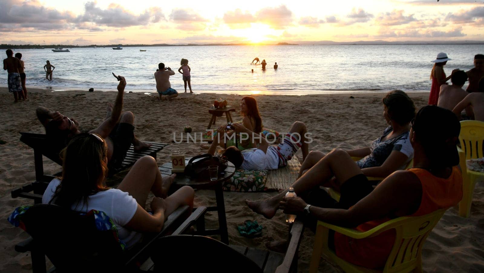 Camamu, bahia / brazil - december 27, 2011: people are seen during sunset at Ponta de Muta beach, in the district of Barra Grande in the city of Camamu.