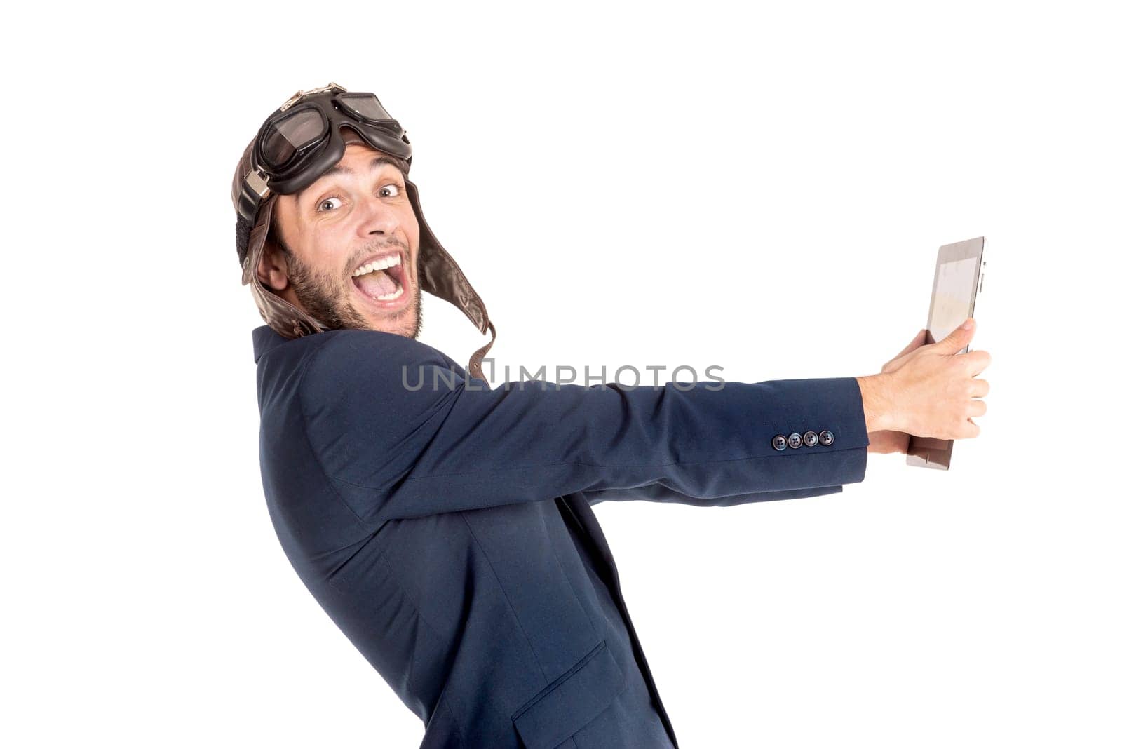 Businessman with pilot goggles and tablet isolated in white