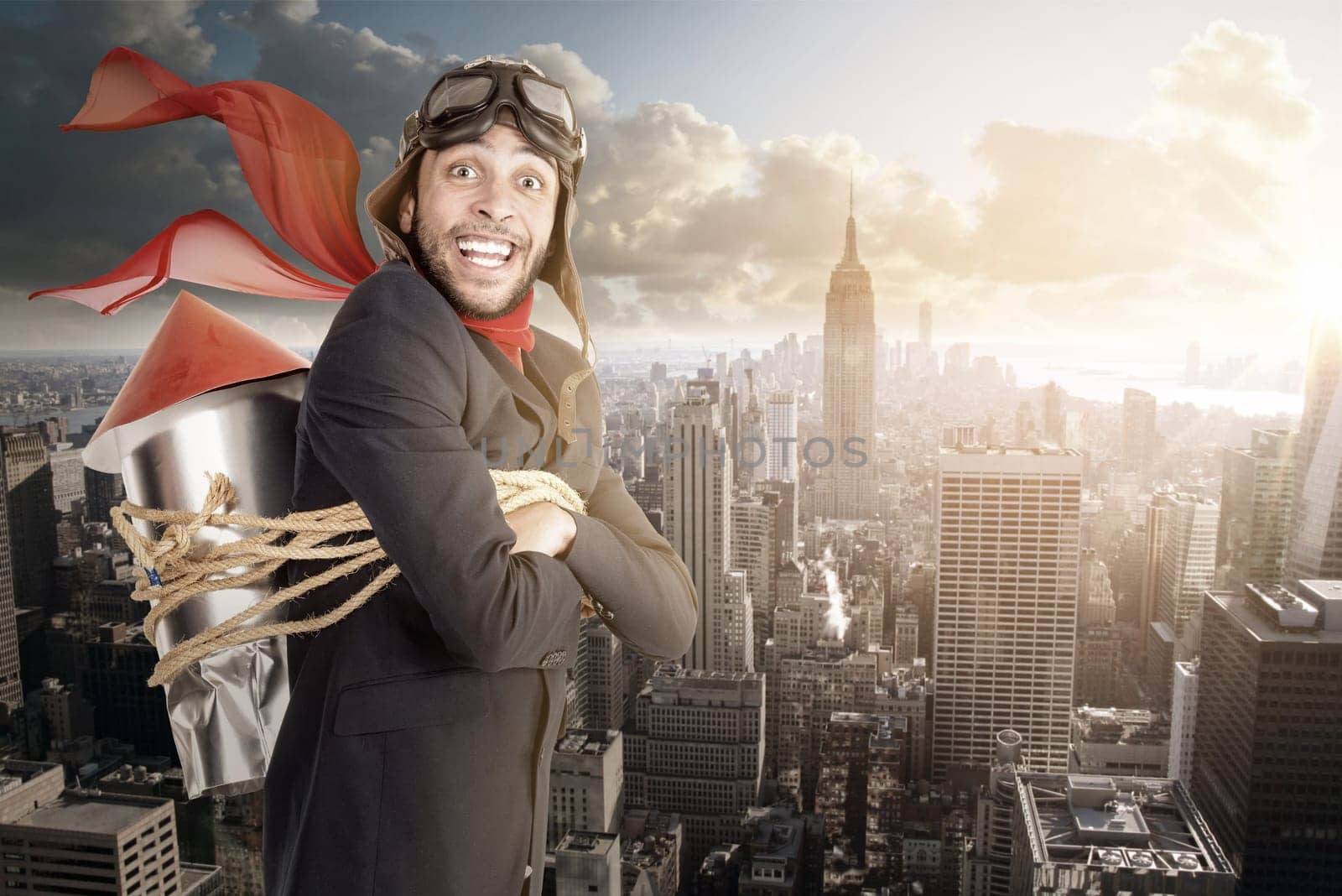 Businessman with homemade rocket and googles ready for a challenge