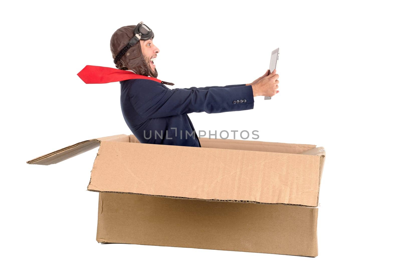 Businessman with tablet flying a carboard box isolated in white