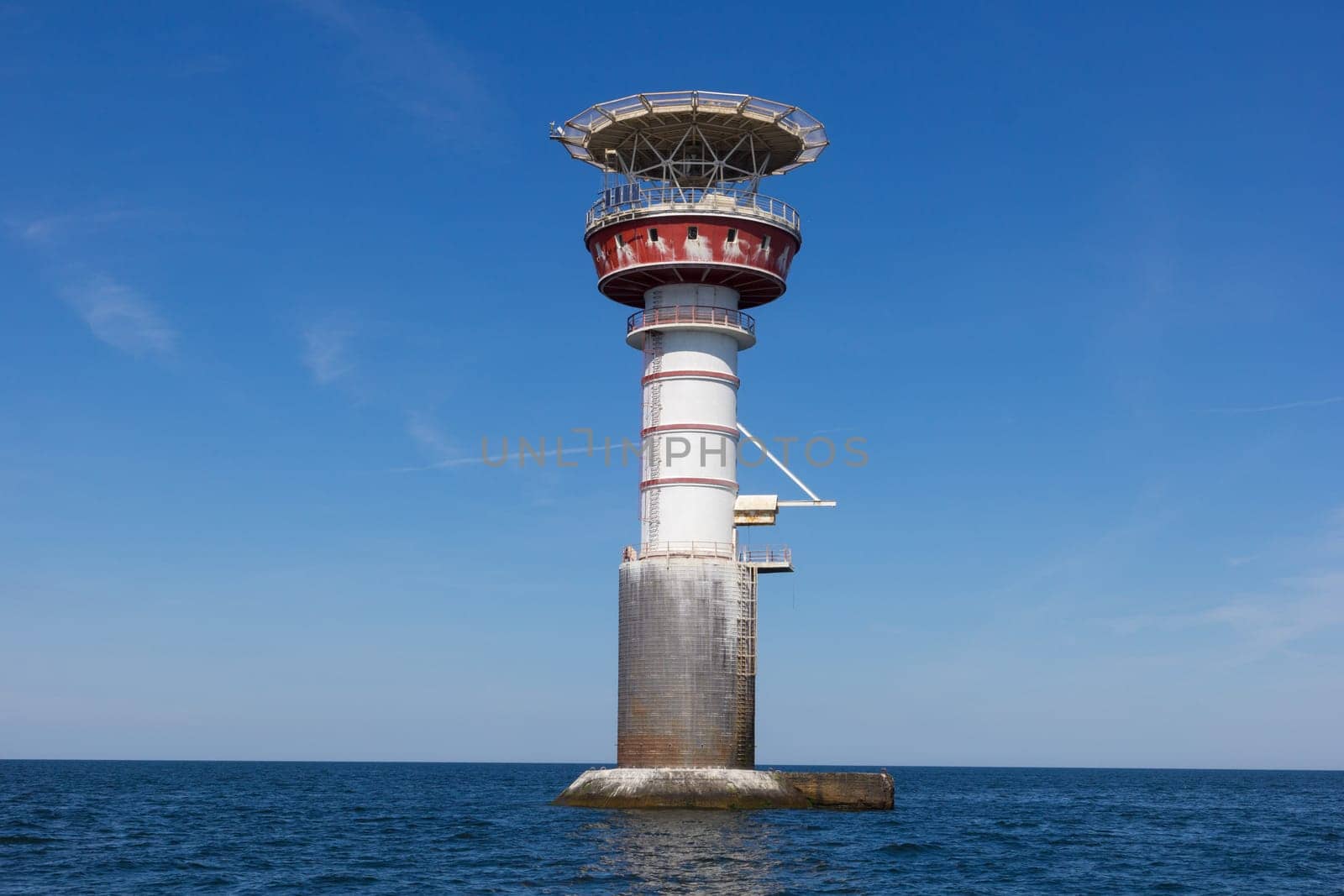 Irbe lighthouse in Baltic sea. Built in 1979 in Mihaila Michaels bank, claimed by Soviet media as the largest nuclear-powered lighthouse in USSR. Formerly inhabited, has a helicopter platform on the top, nowadays it is powered by solar energy.