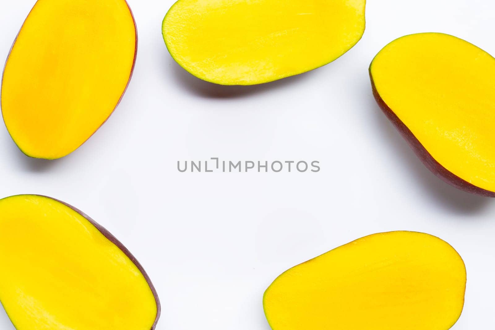 Tropical fruit, Frame made of mango slices on white background. Top view