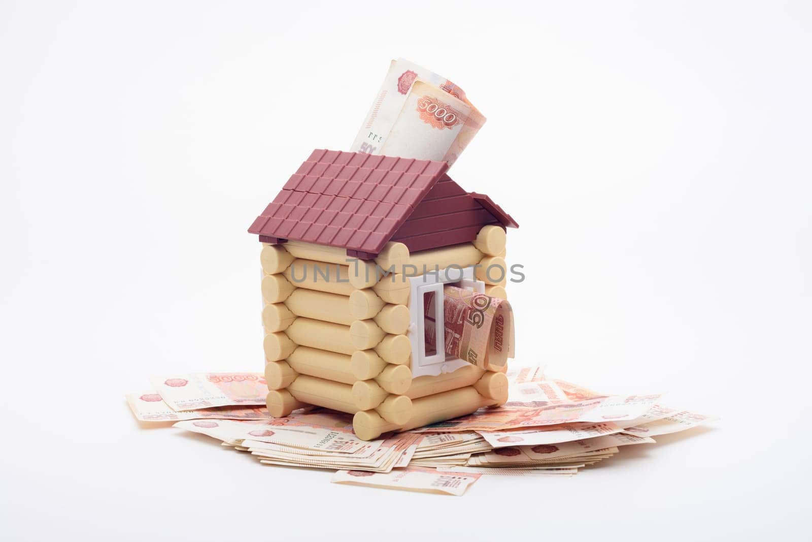 Five-thousandth Russian banknotes stick out from the house