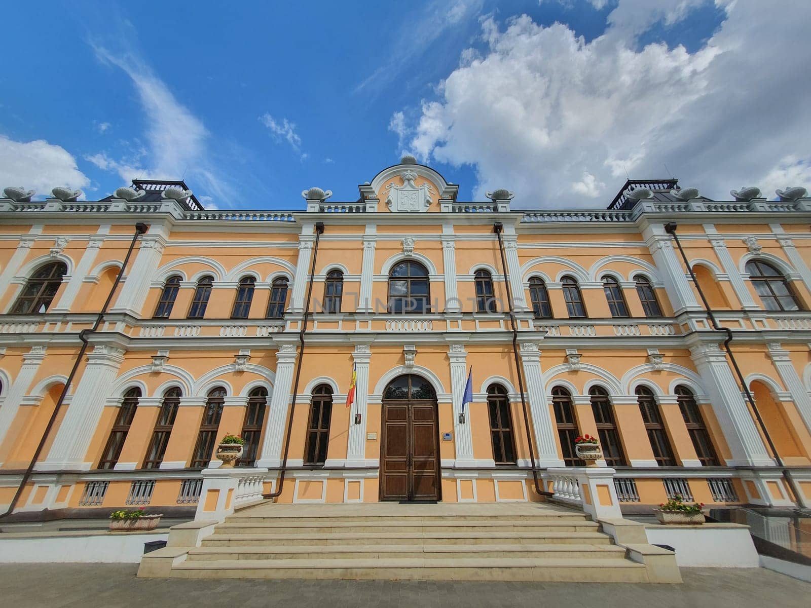Wide angle shot of Manuc Bei mansion, architectural, culture and historic complex with museum, winery and other edifices, Hincesti, Moldova. Manuc Bey palace facade panoramic view..