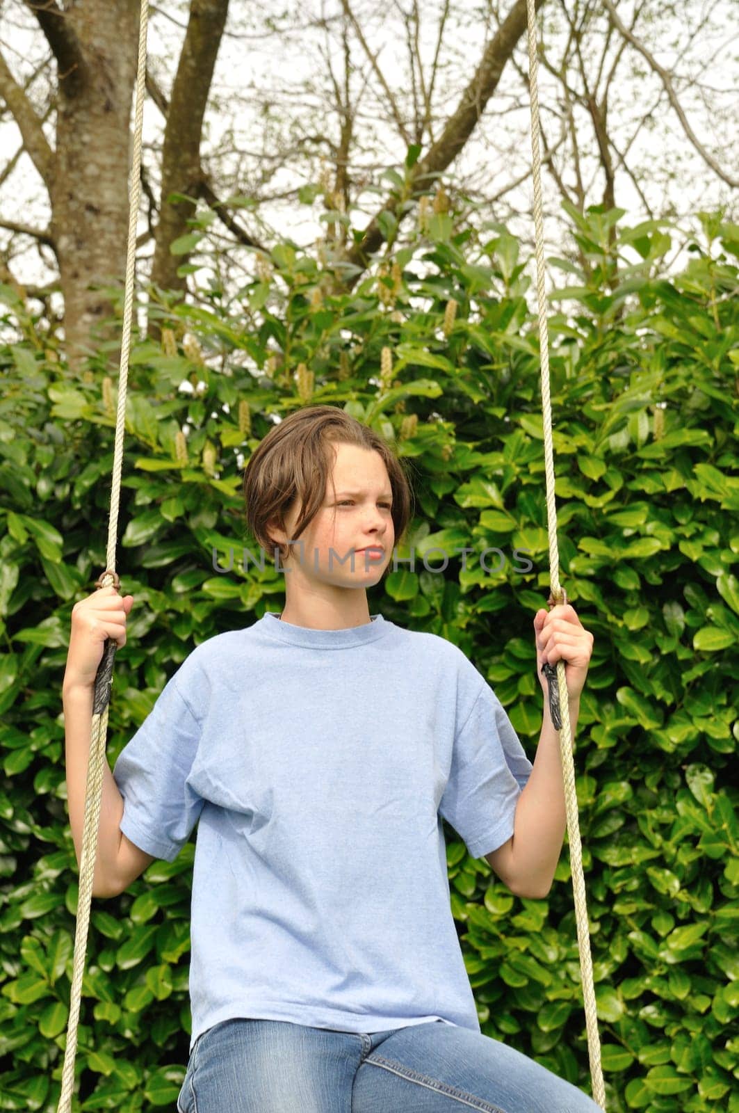 A girl playing in a swing