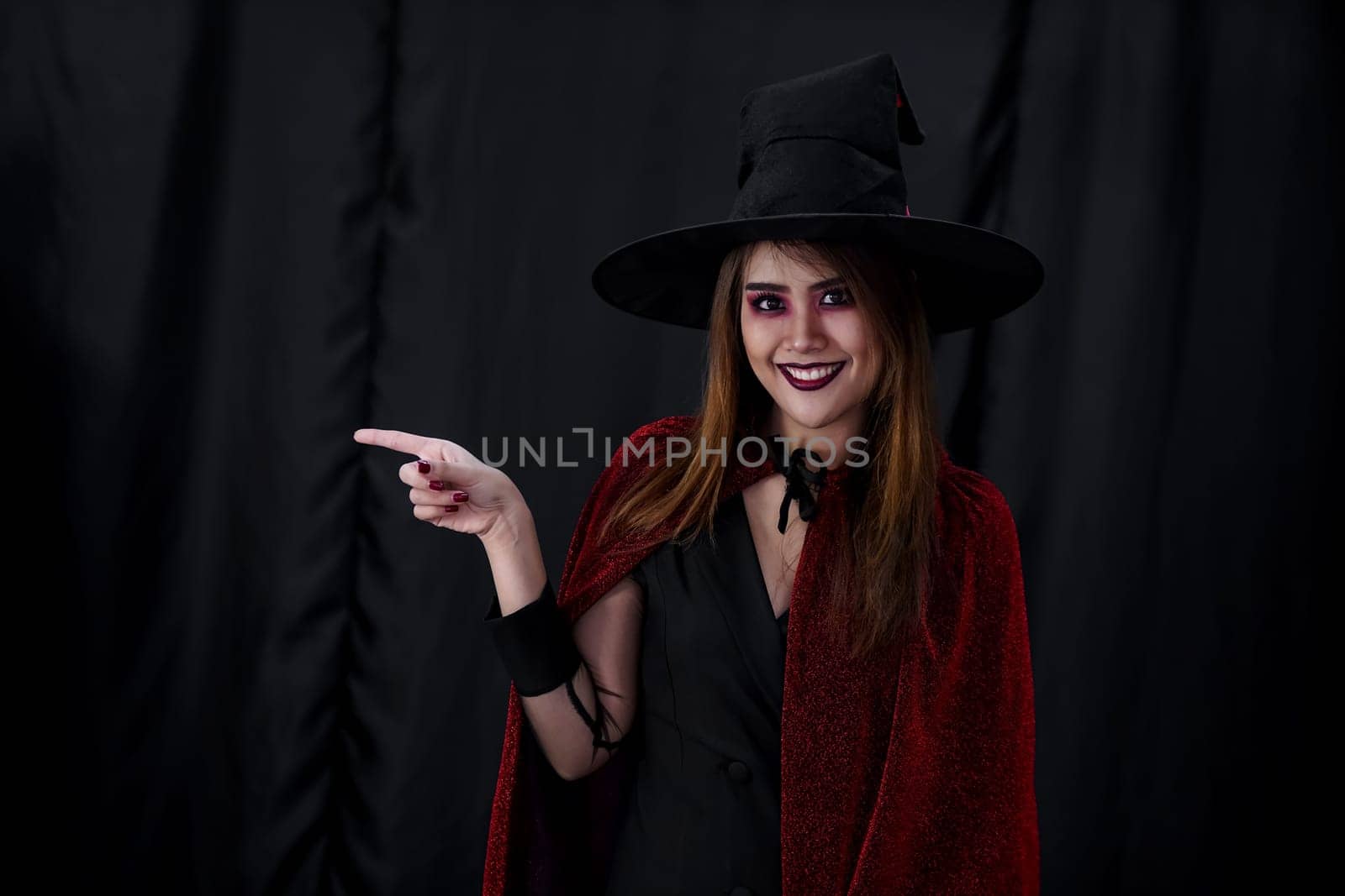 Portrait of asian young adult teenage woman wear Halloween costume cloth for Halloween party carnival. Halloween celebrate and international holiday concept.