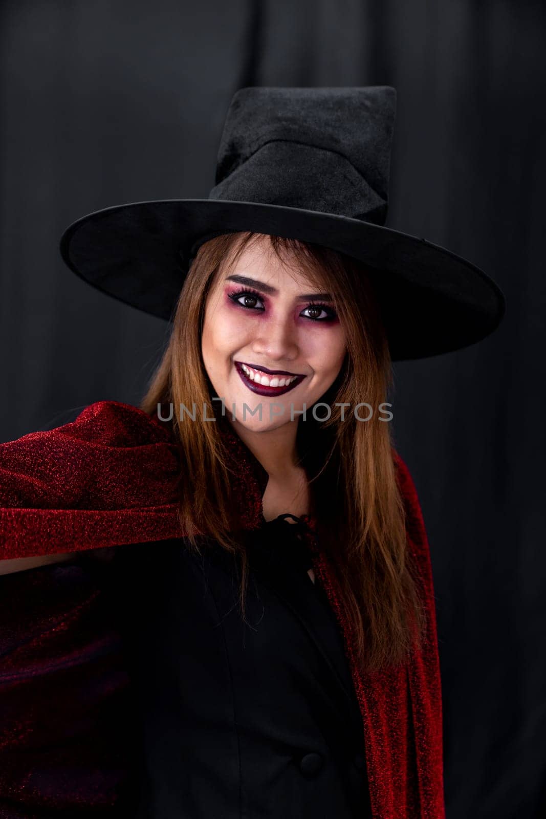 Portrait of asian young adult teenage woman wear Halloween costume cloth for Halloween party carnival. Halloween celebrate and international holiday concept.