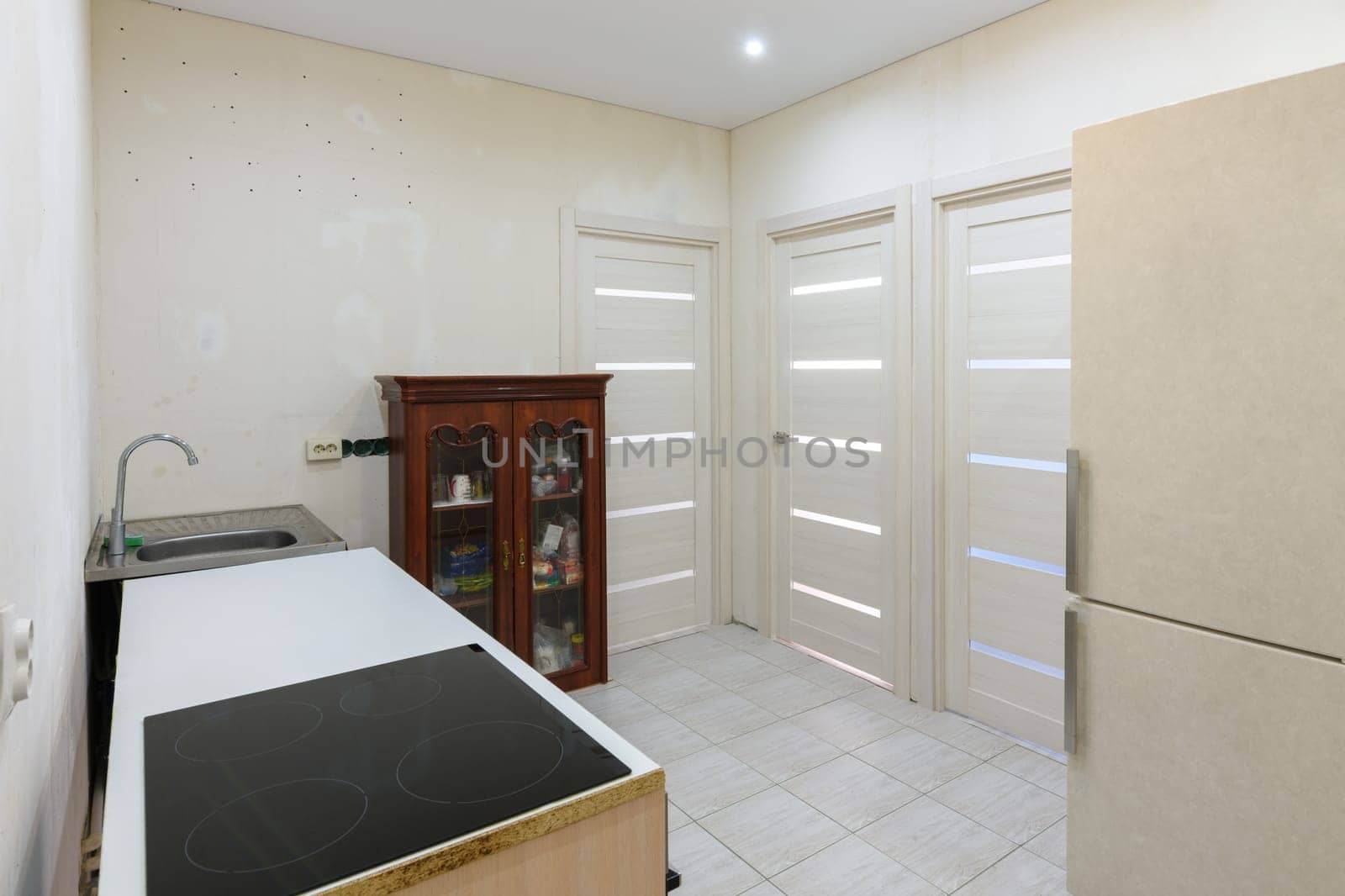 Kitchen interior with temporary poor furniture in a new building