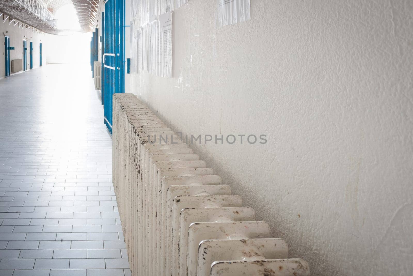 Radiator in an old prison. Metaphor of Heat in a cool place.