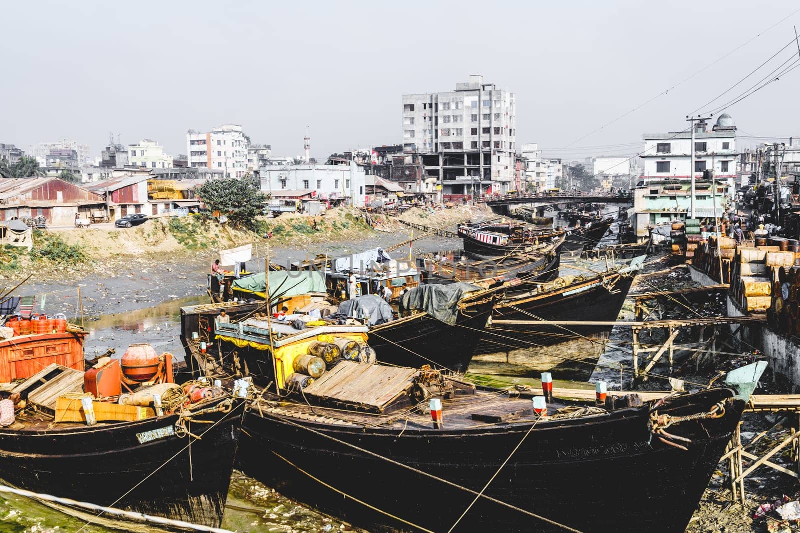 Chittagong, Bangladesh, December 23, 2017: Fishng boats in a canal near fish market in Chittagong, Bangladesh
