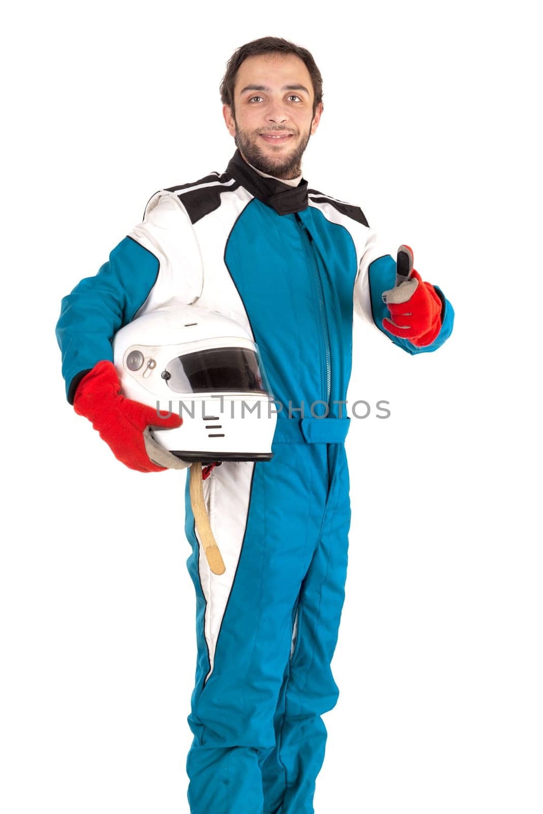 Racing driver posing with helmet isolated in white