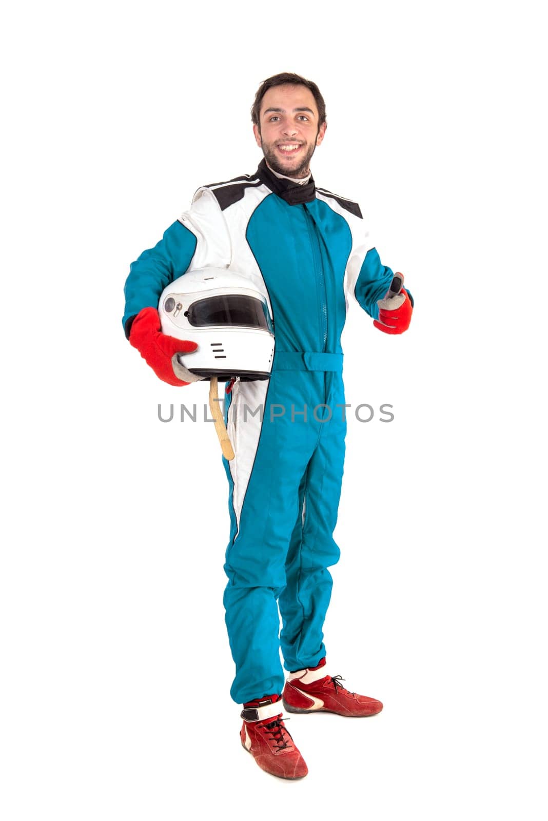 Racing driver posing with helmet isolated in white