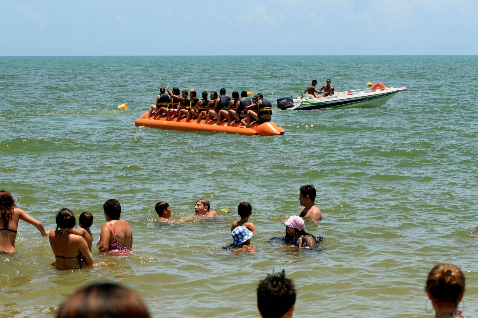 porto seguro, bahia / brazil - january 8, 2009: People are seen aboard a vessel known as a banana boat on the beach in the city of Porto Seguro.