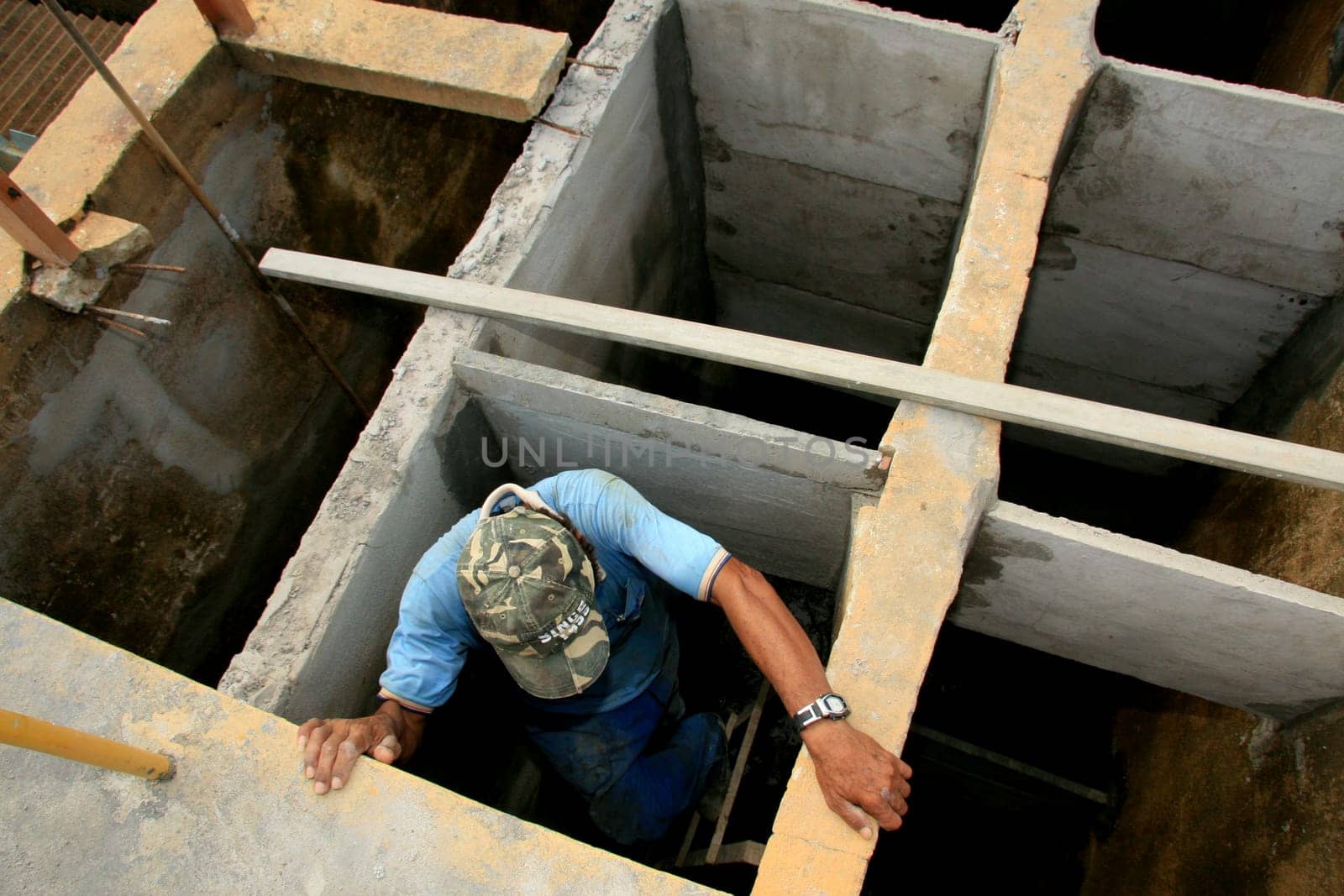 eunapolis, bahia / brazil - february 1, 2009: workers work to clean Embasa's water treatment plant in the city of Eunapolis.