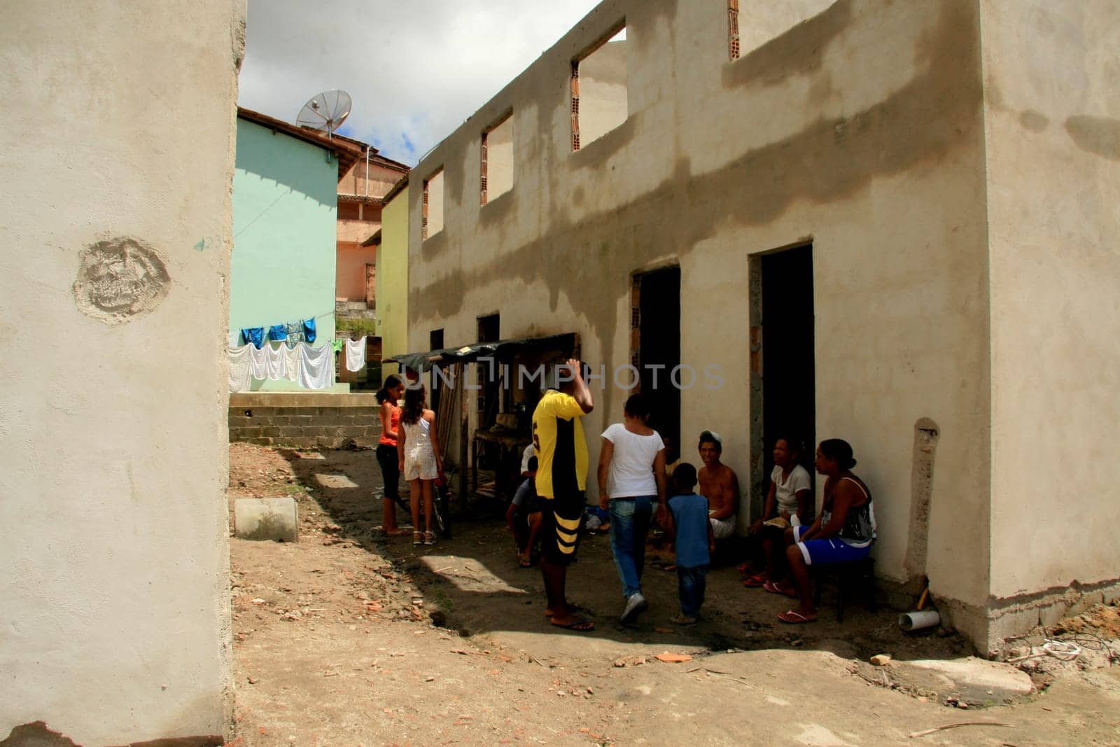 eunapolis, bahia / brazil - january 15, 2009: people who are members of the Association Residents Without a Roof are seen during the invasion of houses under construction, aimed at poor families in the city of Eunapolis....