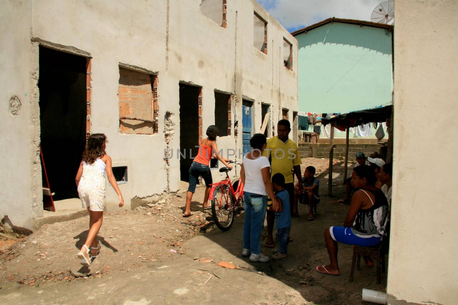 eunapolis, bahia / brazil - january 15, 2009: people who are members of the Association Residents Without a Roof are seen during the invasion of houses under construction, aimed at poor families in the city of Eunapolis....