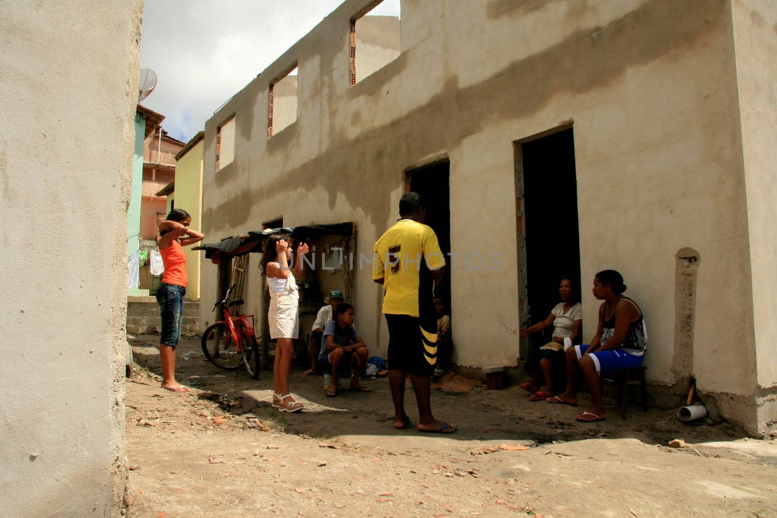 eunapolis, bahia / brazil - january 15, 2009: people who are members of the Association Residents Without a Roof are seen during the invasion of houses under construction, aimed at poor families in the city of Eunapolis....