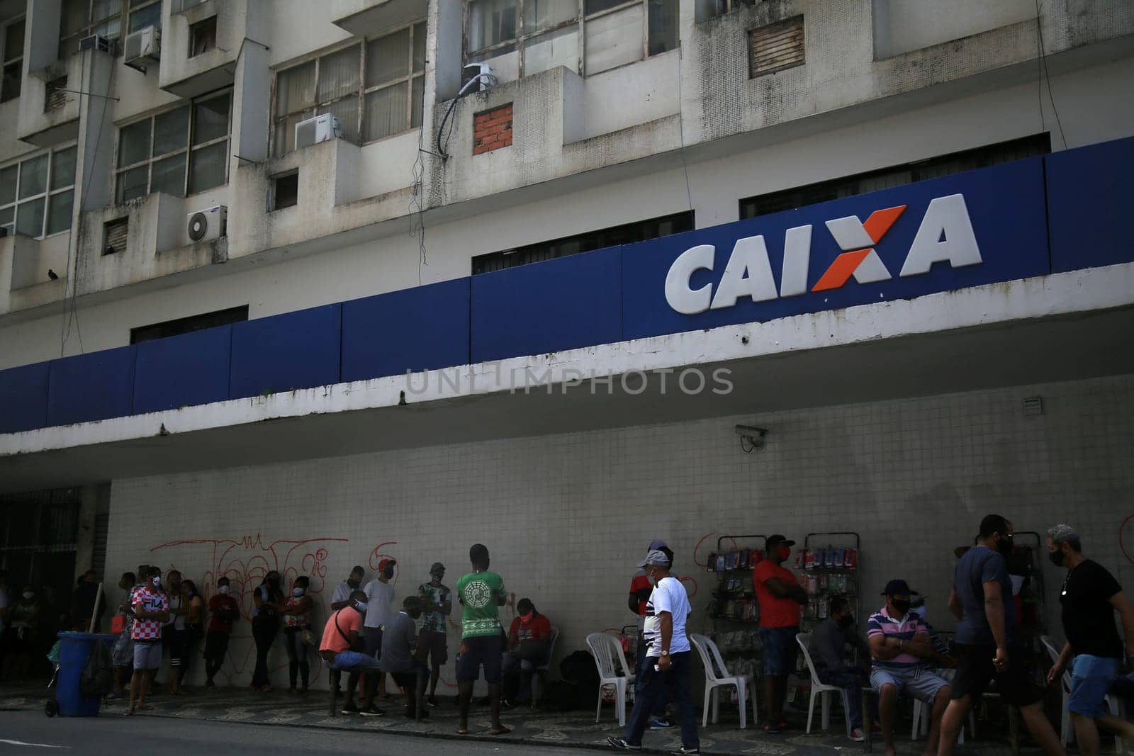 salvador, bahia / brazil - september 8, 2020: people face queues for assistance at Caixa Economica Federal in the neighborhood of Comercio, in the city of Salvador..